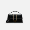 Den stora Bambino Cross-body-väskan med metallklaff Den stora Bambino Cross-body-väskan med metallklaff