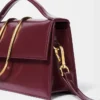 Den stora Bambino Cross-body-väskan med metallklaff Den stora Bambino Cross-body-väskan med metallklaff