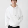 Torsade-tröjan Hoodie med flockad logotyp Torsade-tröjan Hoodie med flockad logotyp